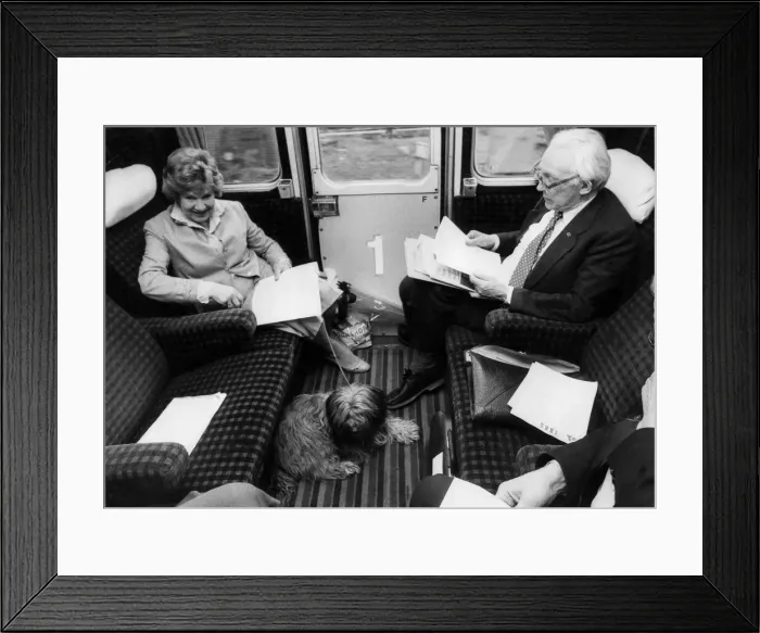 Framed Print : Michael Foot and wife Jill Craigie on train with their dog - May 1983 Framed Print : Michael Foot and wife Jill Craigie on train with their dog - May 1983