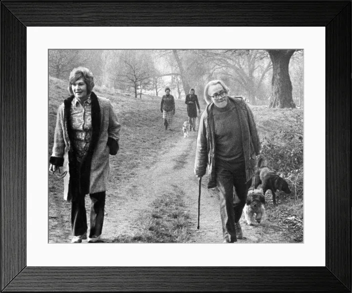 Framed Print : Michael Foot and wife Jill Craigie walking their dogs on Hampstead Heath - March 1974 Framed Print : Michael Foot and wife Jill Craigie walking their dogs on Hampstead Heath - March 1974