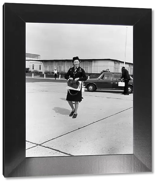 Princess Margaret in Girl Guide uniform leaving Heathrow Airport to fly to Shawbury