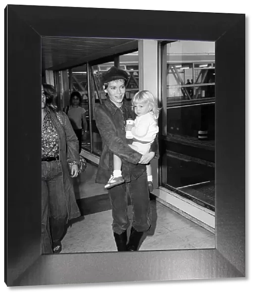 Mia Farrow at Heathrow Airport with her son Fletcher Previn. 27th September 1976