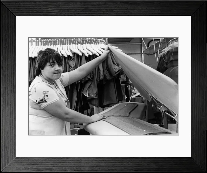 Framed Print : Burtons menswear factory in Guisborough. An employee ensuring a sharp crease Framed Print : Burtons menswear factory in Guisborough. An employee ensuring a sharp crease