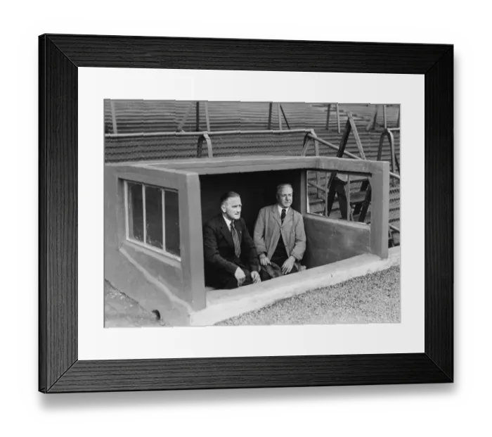 Framed Print : Glasgow Rangers trainer Joe Craven (left) in the Rangers Doug-out with a member of staff