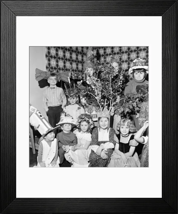 Framed Print : Children compete in a Fancy Hat Competition, Teesside, North East England, January 1974 Framed Print : Children compete in a Fancy Hat Competition, Teesside, North East England, January 1974