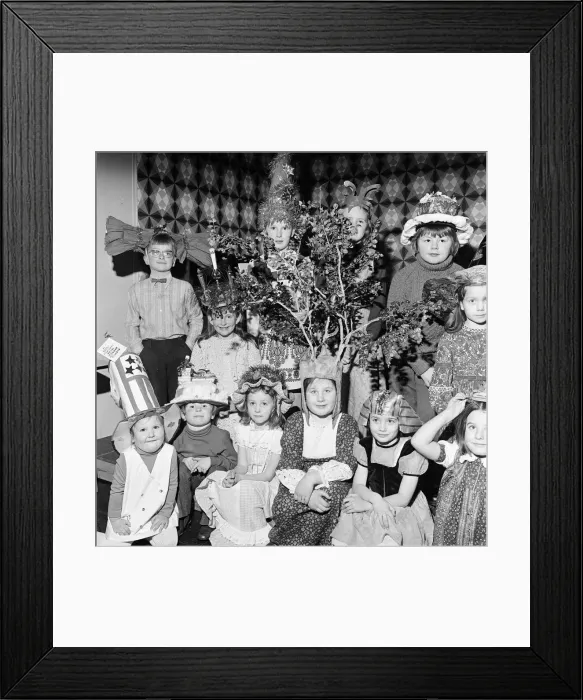 Framed Print : Children compete in a Fancy Hat Competition, Teesside, North East England, January 1974 Framed Print : Children compete in a Fancy Hat Competition, Teesside, North East England, January 1974
