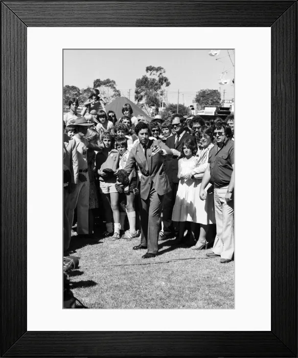 Framed Print : Prince Charles throwing a cow pat (dung) at the opening of Agro 79 Framed Print : Prince Charles throwing a cow pat (dung) at the opening of Agro 79