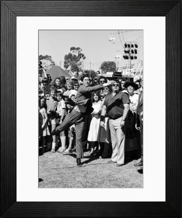 Framed Print : Prince Charles throwing a cow pat (dung) at the opening of Agro 79 Framed Print : Prince Charles throwing a cow pat (dung) at the opening of Agro 79