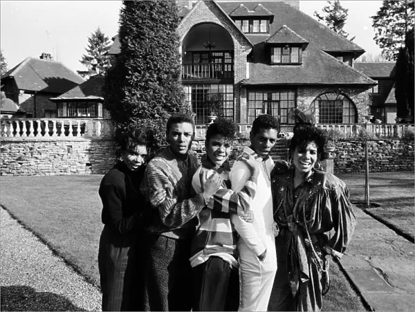 Pop group Five Star outside their new home Stone Court in Berkshire. March 1987