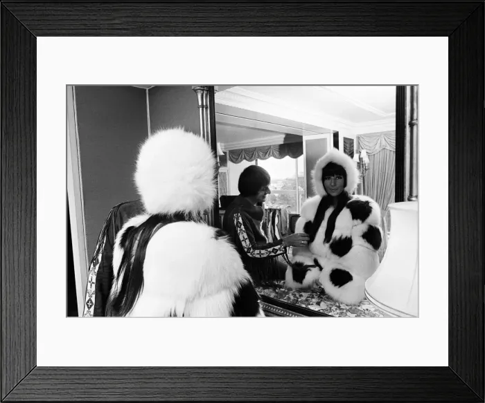 Framed Print : Sonny Bono & Cher, American music duo, pictured in their rooms at the Royal Garden Hotel Framed Print : Sonny Bono & Cher, American music duo, pictured in their rooms at the Royal Garden Hotel