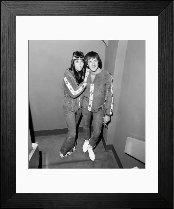Framed Print : Sonny Bono & Cher, American music duo, pictured at the Royal Garden Hotel, London Framed Print : Sonny Bono & Cher, American music duo, pictured at the Royal Garden Hotel, London