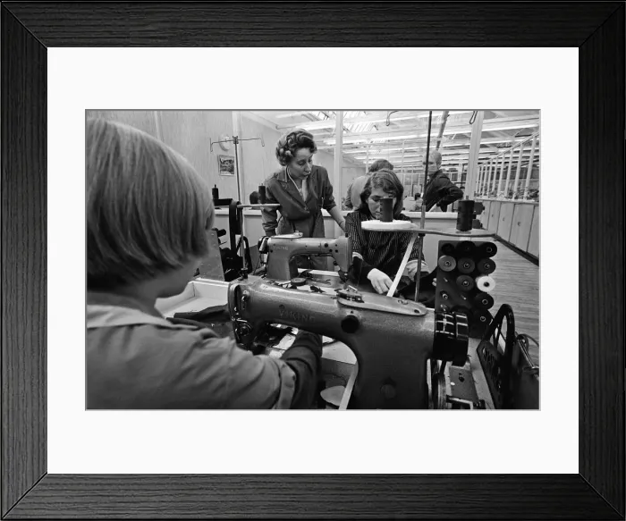 Framed Print : Staff at work at Burton the Tailors, Leeds. Mrs Mary Kirby teaches Sylvia James, 15 Framed Print : Staff at work at Burton the Tailors, Leeds. Mrs Mary Kirby teaches Sylvia James, 15