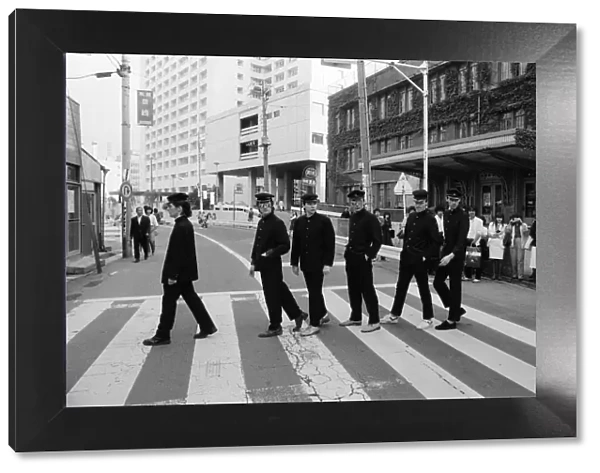 The Boomtown Rats in Tokyo. Pictured walking across a road are the members
