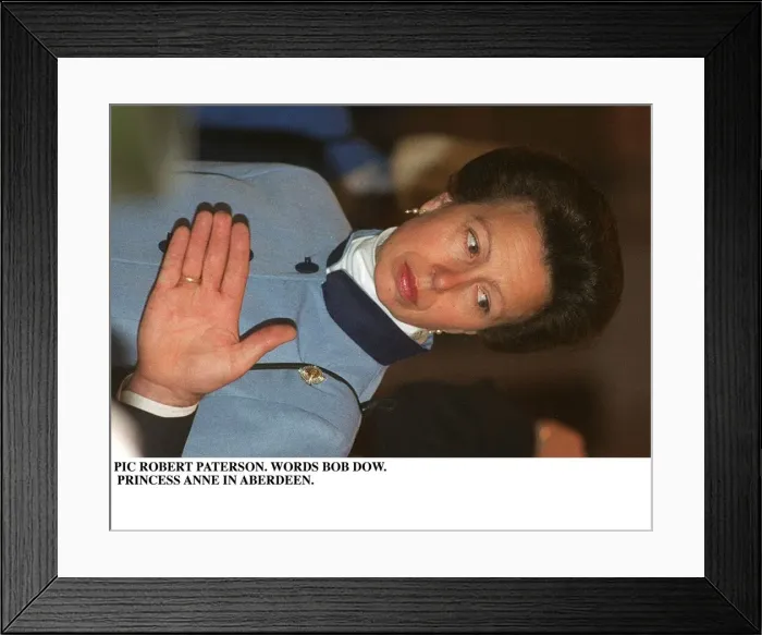 Framed Print : Princess Anne in Aberdeen wearing blue jacket hand in front