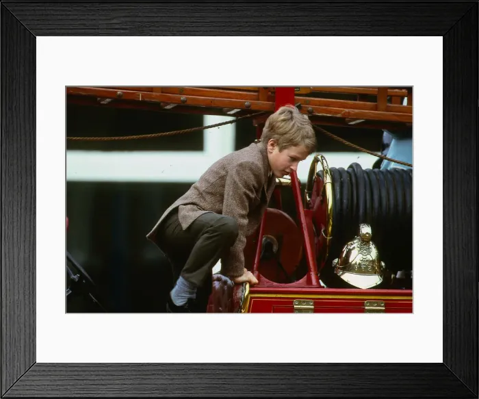 Framed Print : Peter Phillips January 1988 son of Princess Anne scrambles over top of old fire