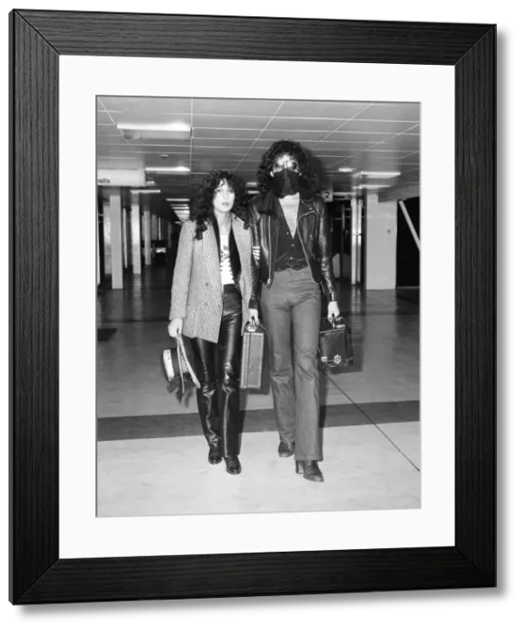 Framed Print : American singer Cher and Gene Simmons, bass guitarist with rock group Kiss, Arrivals Framed Print : American singer Cher and Gene Simmons, bass guitarist with rock group Kiss, Arrivals