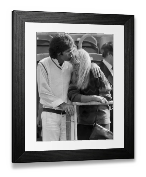 Framed Print : Sue Barker and Cliff Richard kissing in stands at tennis tournament - June 1983
