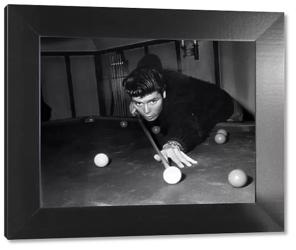 Cliff Richard playing pool in his new home Rookswood, Essex, UK