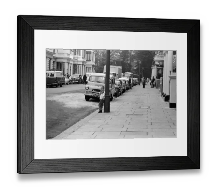 Framed Print : A young boy watching the filming of Two Weeks in September