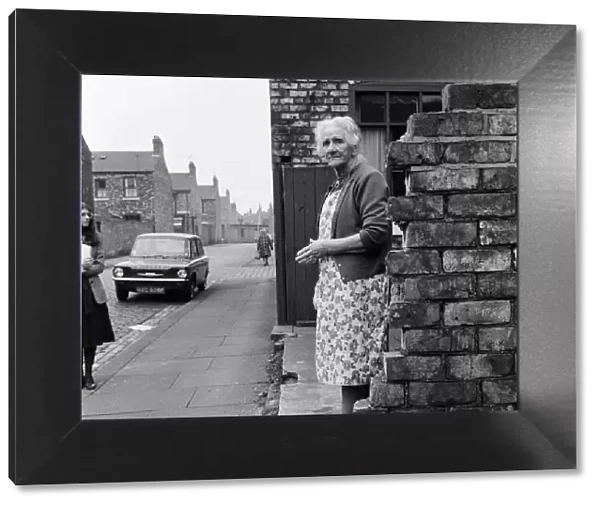 A woman standing in the street in Middlesbrough. 1971