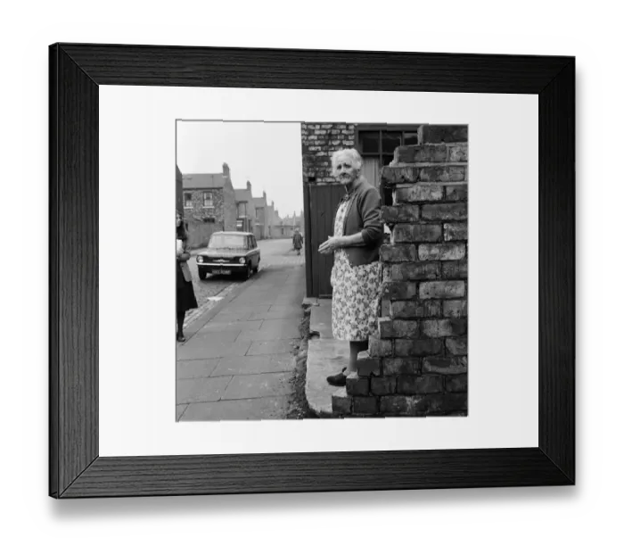 Framed Print : A woman standing in the street in Middlesbrough. 1971 Framed Print : A woman standing in the street in Middlesbrough. 1971
