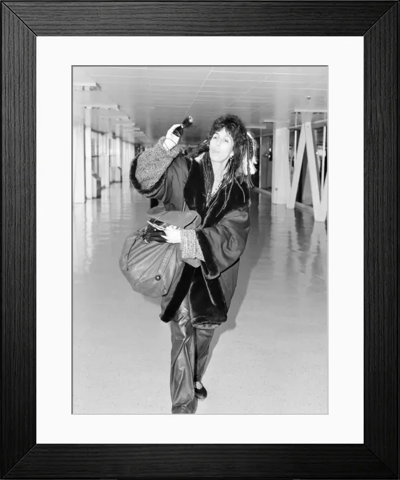 Framed Print : Cher, American actress and singer, Departures, London Heathrow Airport Framed Print : Cher, American actress and singer, Departures, London Heathrow Airport