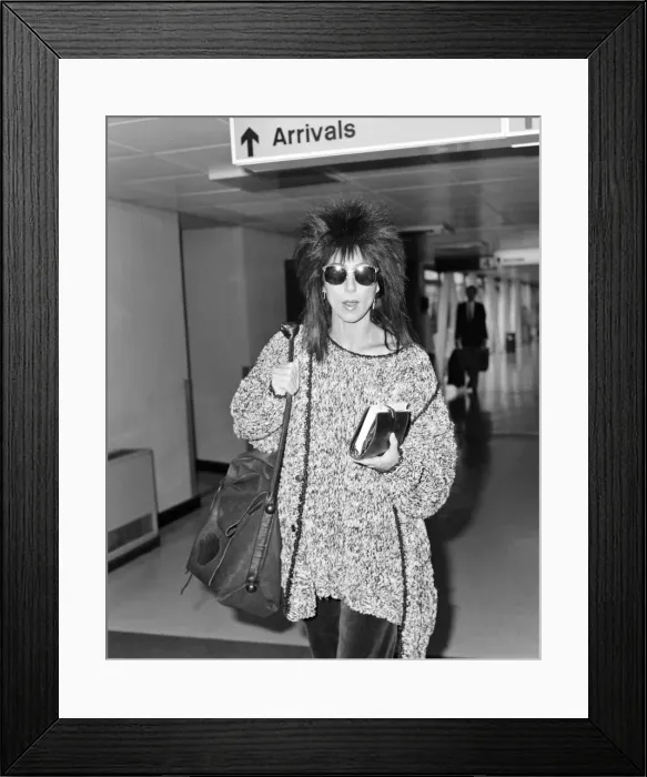 Framed Print : Cher, American actress and singer, Departures, London Heathrow Airport