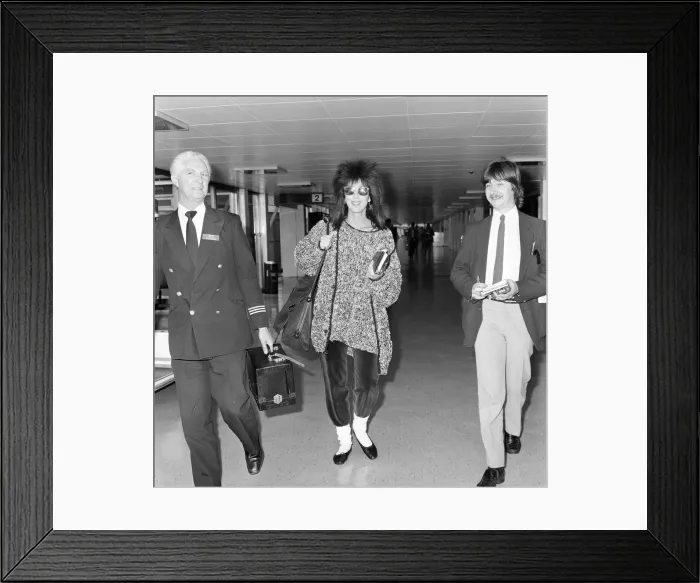 Framed Print : Cher, American actress and singer, Departures, London Heathrow Airport Framed Print : Cher, American actress and singer, Departures, London Heathrow Airport