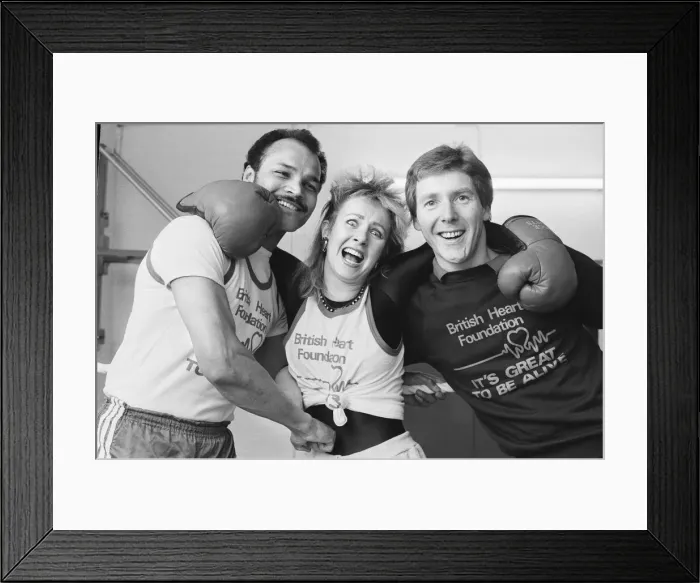 Framed Print : Saturday presenter Sarah Green, helped put John Conteh (left Framed Print : Saturday presenter Sarah Green, helped put John Conteh (left