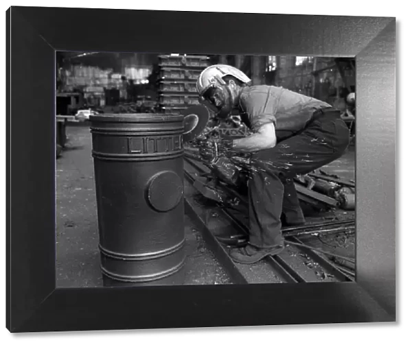 Parkfield Foundries in Stockton on Tees. Foundry worker Roy Moore with a litter bin for
