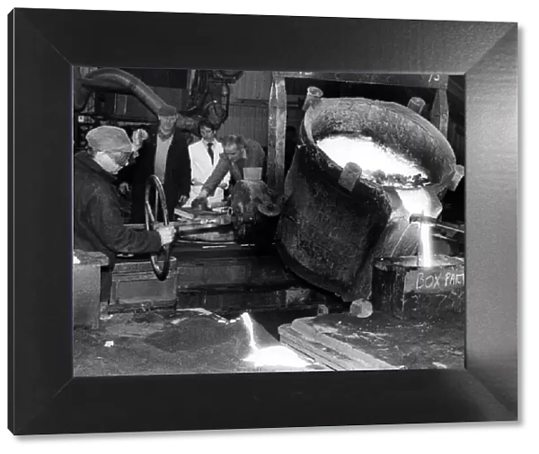 Molten metal is poured out by caster Brian Hunter at Parkfield Foundry, Stockton