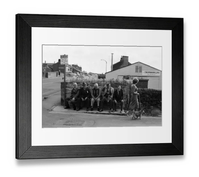 Framed Print : Old boys watch the girls go by from the bench at the junction of Keighly Road, Silsden