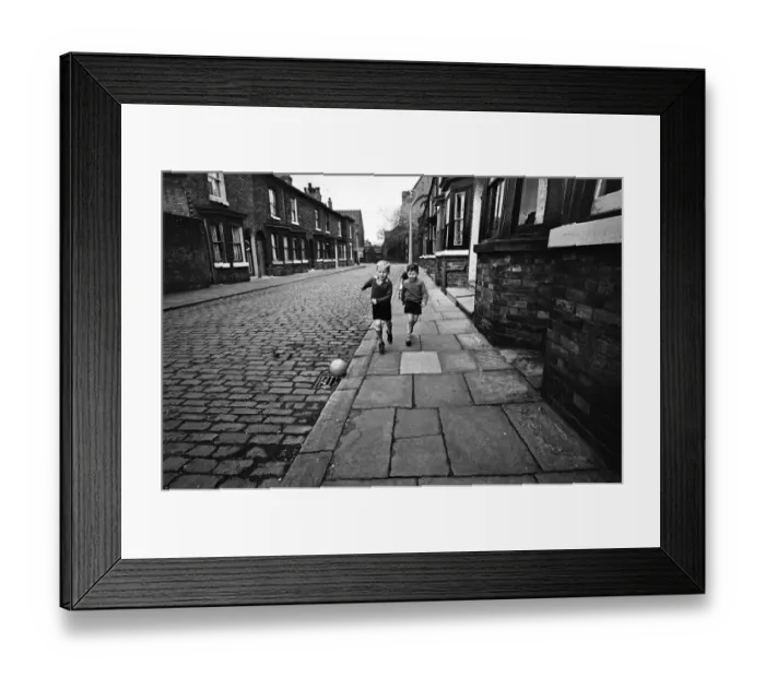 Framed Print : Children playing football in Archie Street, Manchester. Archie Street was the inspiration