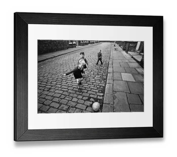 Framed Print : Children playing football in Archie Street, Manchester. Archie Street was the inspiration