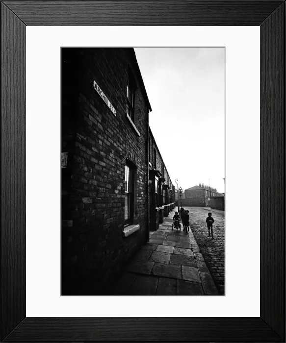 Framed Print : Children playing football in Archie Street, Manchester. Archie Street was the inspiration