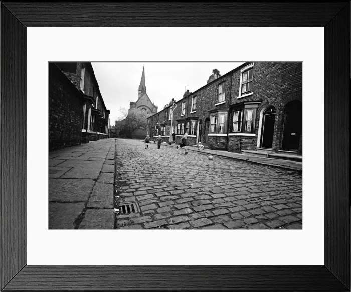 Framed Print : Children playing football in Archie Street, Manchester. Archie Street was the inspiration