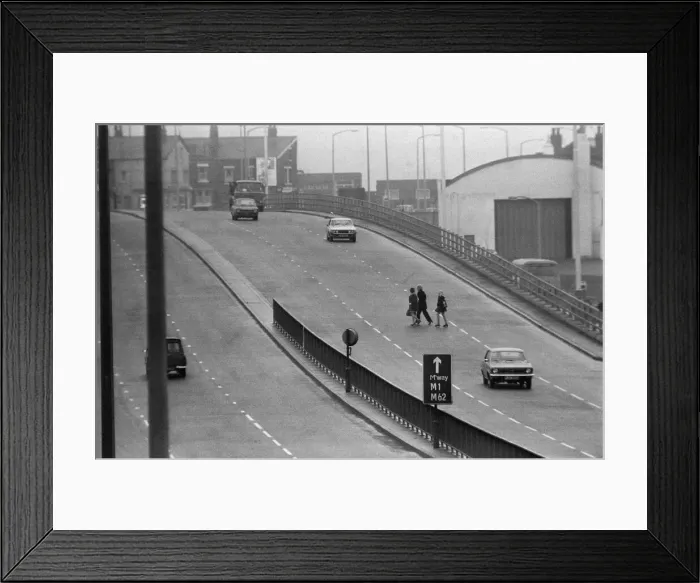 Framed Print : People crossing the motorway dangerously, in the north of England. 8th November 1974 Framed Print : People crossing the motorway dangerously, in the north of England. 8th November 1974
