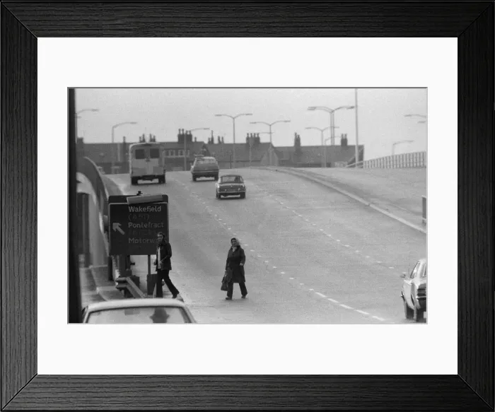 Framed Print : People crossing the motorway dangerously, in the north of England. 11th November 1974 Framed Print : People crossing the motorway dangerously, in the north of England. 11th November 1974