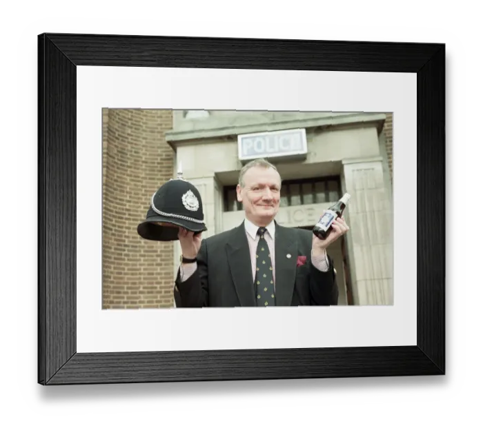 Framed Print : Supt Roger Bagley of Dudley Police with a bottle of Bobby Bitter s