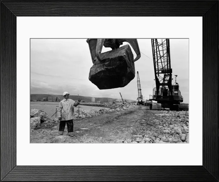 Framed Print : Steel Company of Wales worker David Pinch, 20 directs a huge American crane Framed Print : Steel Company of Wales worker David Pinch, 20 directs a huge American crane