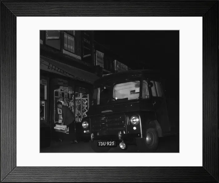 Framed Print : A W H Smith wholesale newsagents delivery driver seen here leaving the morning papers Framed Print : A W H Smith wholesale newsagents delivery driver seen here leaving the morning papers