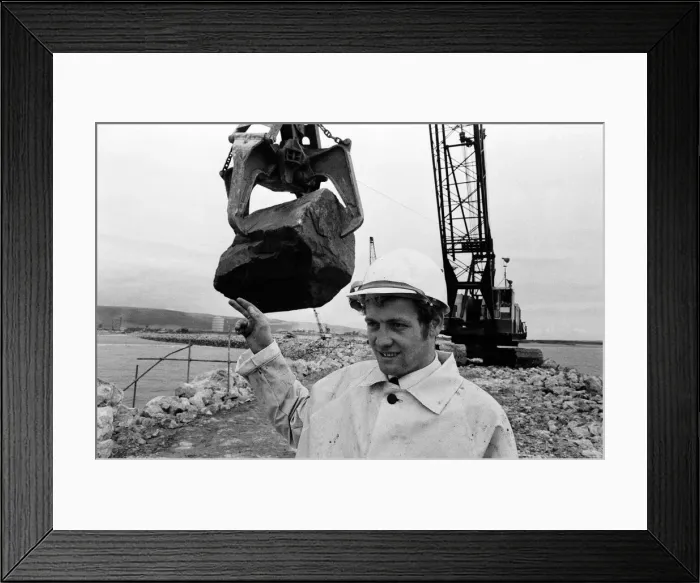 Framed Print : Steel Company of Wales worker David Pinch, 20 directs a huge American crane Framed Print : Steel Company of Wales worker David Pinch, 20 directs a huge American crane