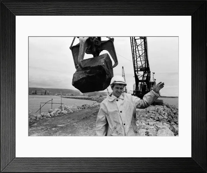 Framed Print : Steel Company of Wales worker David Pinch, 20 directs a huge American crane Framed Print : Steel Company of Wales worker David Pinch, 20 directs a huge American crane