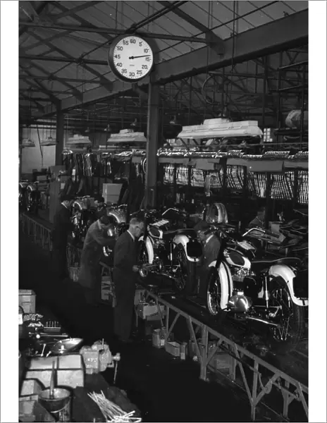 Production line at Triumph Motorcycles factory at Meriden. Circa 1955