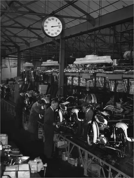 Production line at Triumph Motorcycles factory at Meriden. Circa 1955