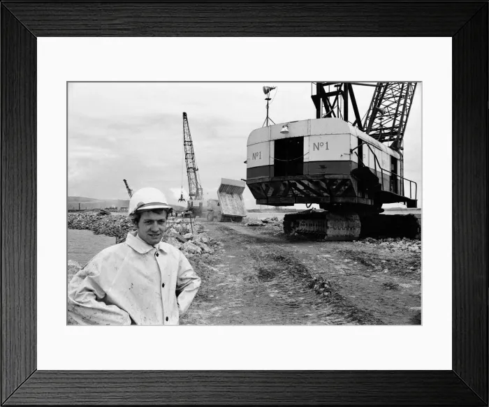 Framed Print : Steel Company of Wales worker David Pinch, 20 directs a huge American crane Framed Print : Steel Company of Wales worker David Pinch, 20 directs a huge American crane