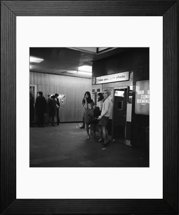 Framed Print : Women standing outside a photo booth in Birmingham, West Midlands. 4th October 1967 Framed Print : Women standing outside a photo booth in Birmingham, West Midlands. 4th October 1967