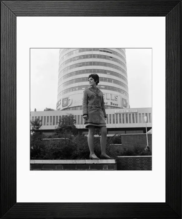 Framed Print : A woman standing in front of the Rotunda in Birmingham, West Midlands. 4th October 1967 Framed Print : A woman standing in front of the Rotunda in Birmingham, West Midlands. 4th October 1967