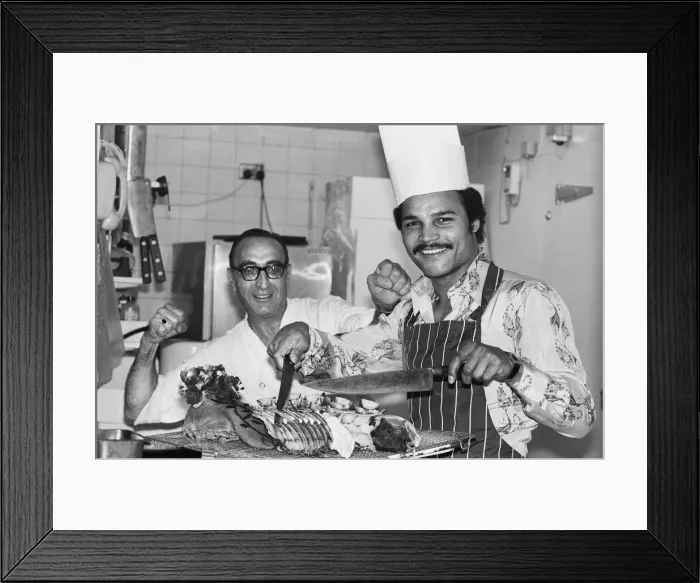 Framed Print : Boxer John Conteh with chef William Vassalo. 28th September 1977 Framed Print : Boxer John Conteh with chef William Vassalo. 28th September 1977