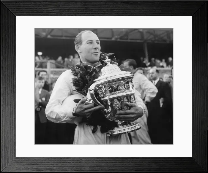 Framed Print : Stirling Moss holding trophy wearing wreath celebrating motor racing victory - April 1958 Framed Print : Stirling Moss holding trophy wearing wreath celebrating motor racing victory - April 1958
