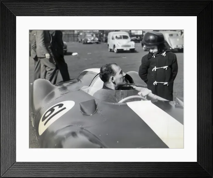 Framed Print : STIRLING MOSS IN HIS COOPER CLIMAX CHATS TO GEOFFREY BRABHAM, AGED 4 OF SYDNEY, AUSTRALIA Framed Print : STIRLING MOSS IN HIS COOPER CLIMAX CHATS TO GEOFFREY BRABHAM, AGED 4 OF SYDNEY, AUSTRALIA