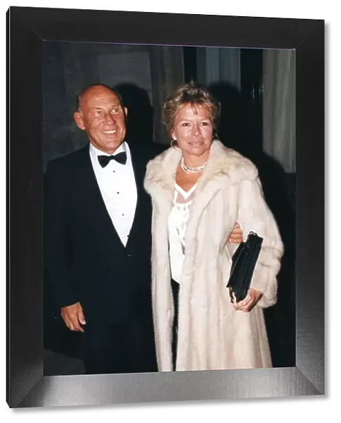 Stirling Moss and wife Susie wearing a fur coat at sports awards ceremony - December 1994